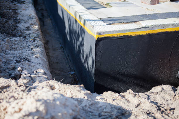 Professional Waterproofing technician working in Collinwood, TN
